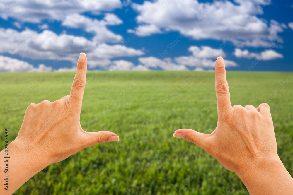 Female Hands Making a Frame Over Grass and Sky Female Hands Making a Frame Over Grass and Sky