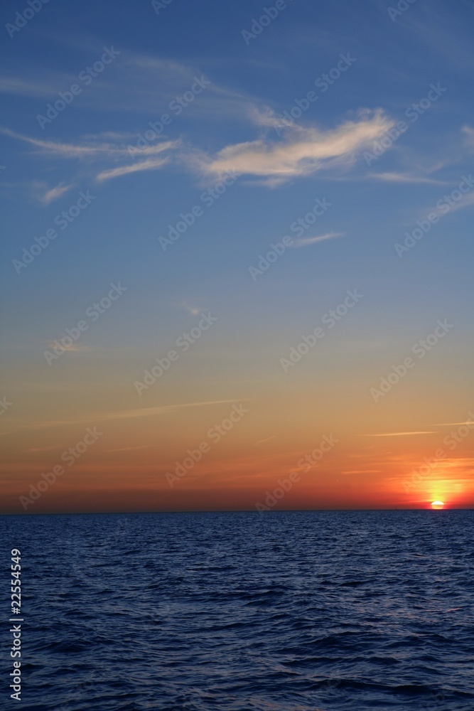 Beautiful sunset sunrise over blue sea ocean red  sky
