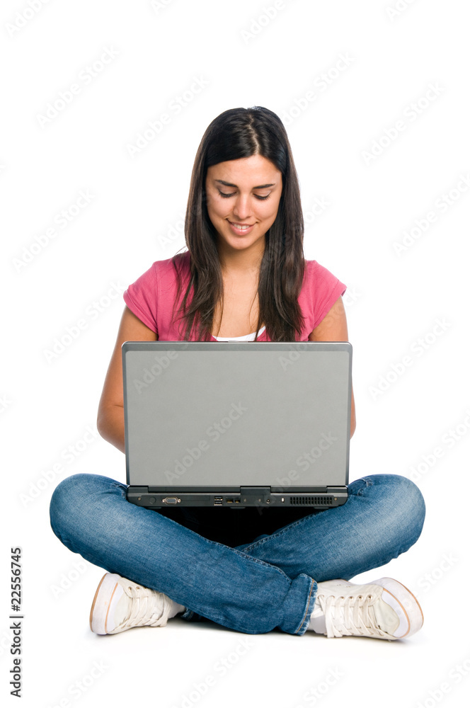 Smiling girl working on laptop Smiling girl working on laptop