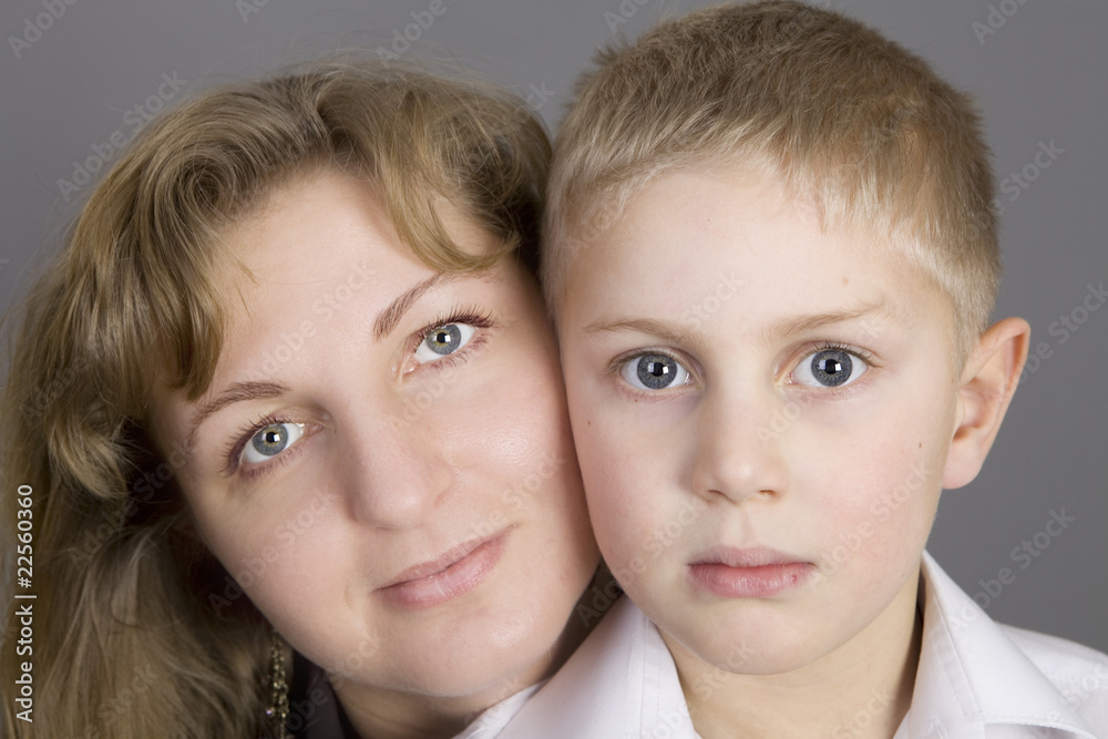 portrait of blond serious mother with her son portrait of blond serious mother with her son