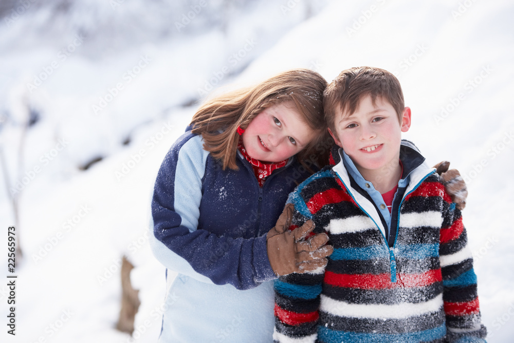 Portrait Of Two Children In Snowy Landscape