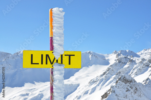 LIMIT sign against mountain scenery