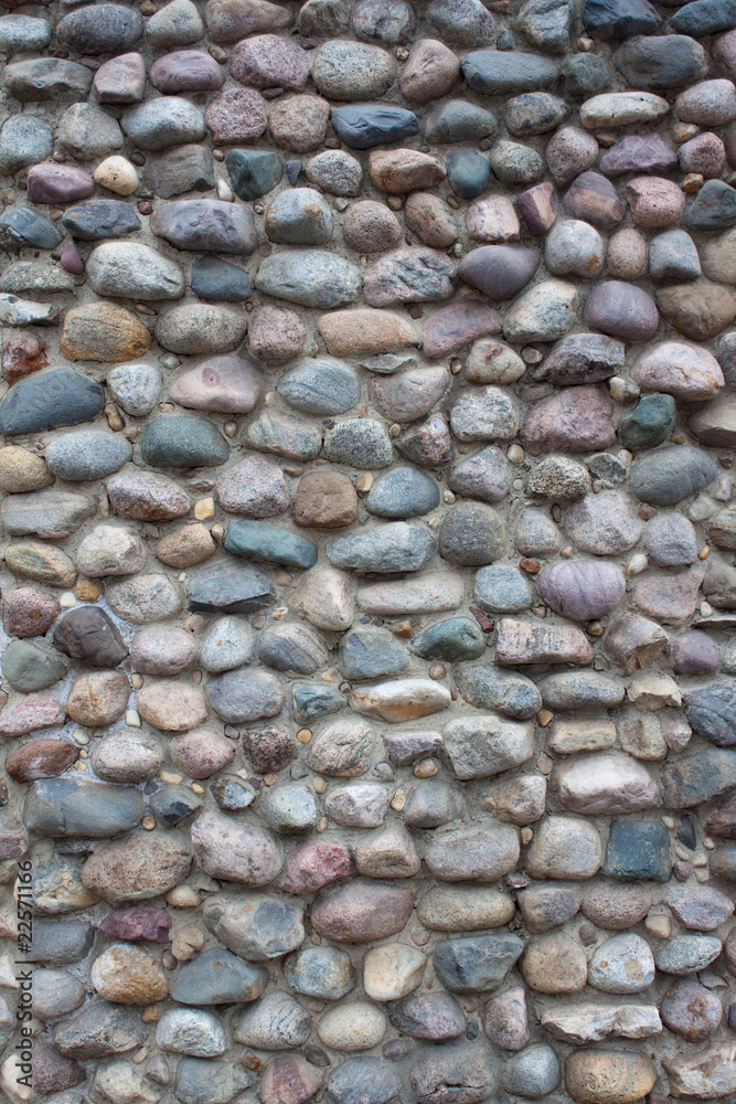 Wall of many-colored cobblestones Wall of many-colored cobblestones