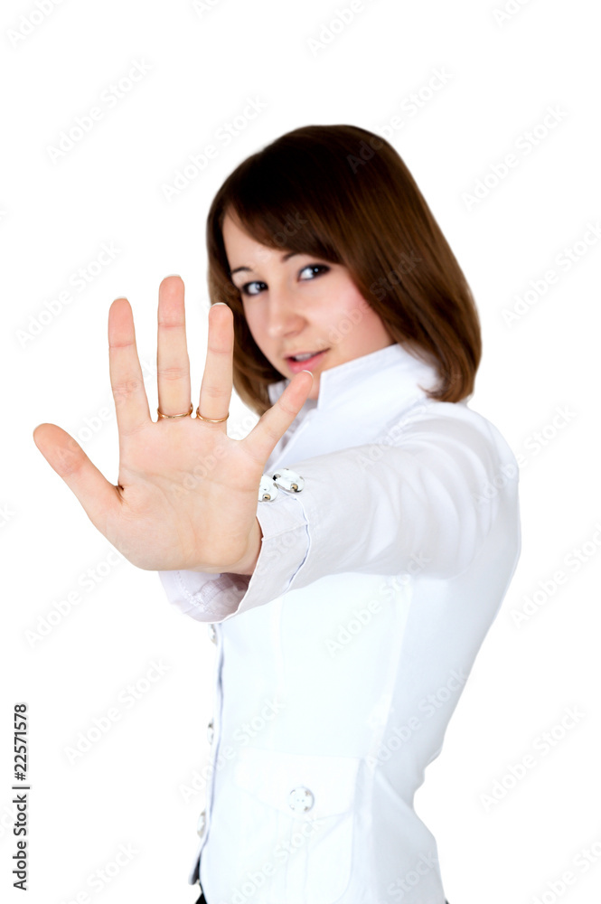 woman in white showing stop. hand in focus woman in white showing stop. hand in focus