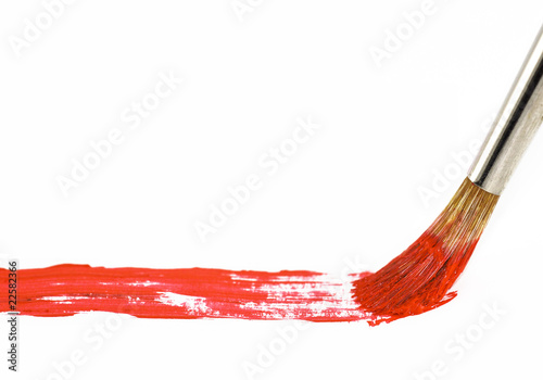 Brush with red paint photo