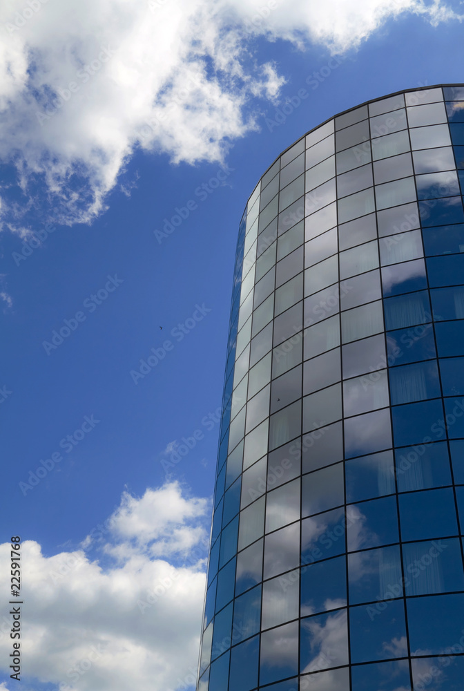 Modern office building and blue sky reflection