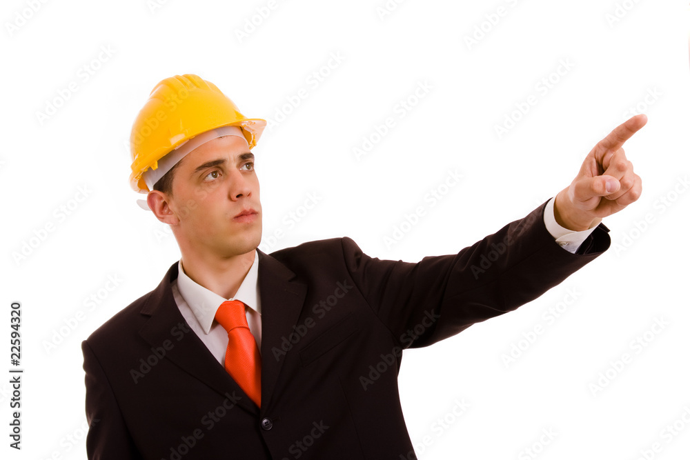 young engineer pointing with is finger in a suit, isolated on wh