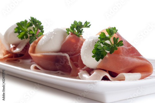 Obraz na płótnie slice parma ham with mozzarella on dish