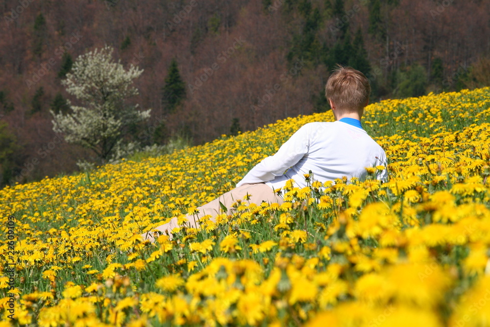 Fototapeta premium Woman in yellow flowers