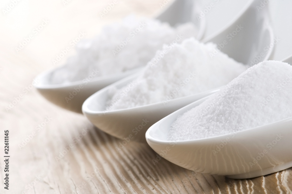 three spoons with difrent salt