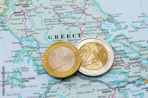 Euro coins on a map of Greece (Greek financial crisis)