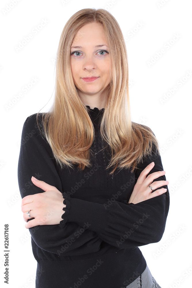 Attractive young blond woman standing with arms crossed Attractive young blond woman standing with arms crossed