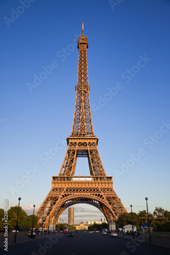Eiffel tower under last rays of sun. Vertical wide angle