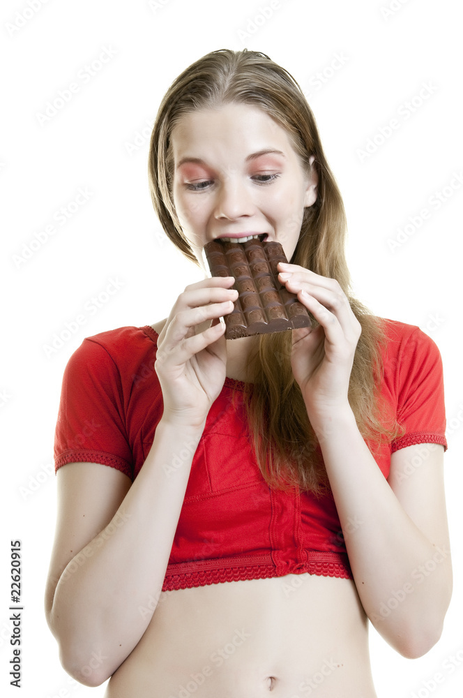young woman enjoying chocolate bar young woman enjoying chocolate bar