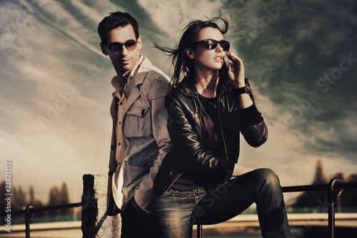 Attractive young couple wearing sunglasses