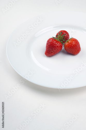 Three strawberry on a plate