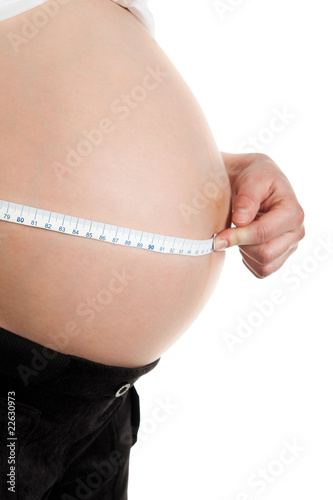 Advanced pregnant belly with hands