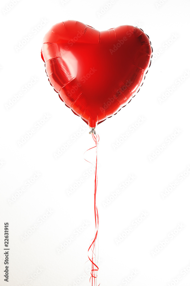 Red heart ballon with red and white strings on white fond Red heart ballon with red and white strings on white fond