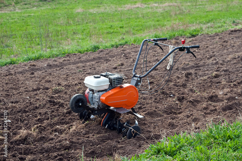 Cultivator on a field. photo