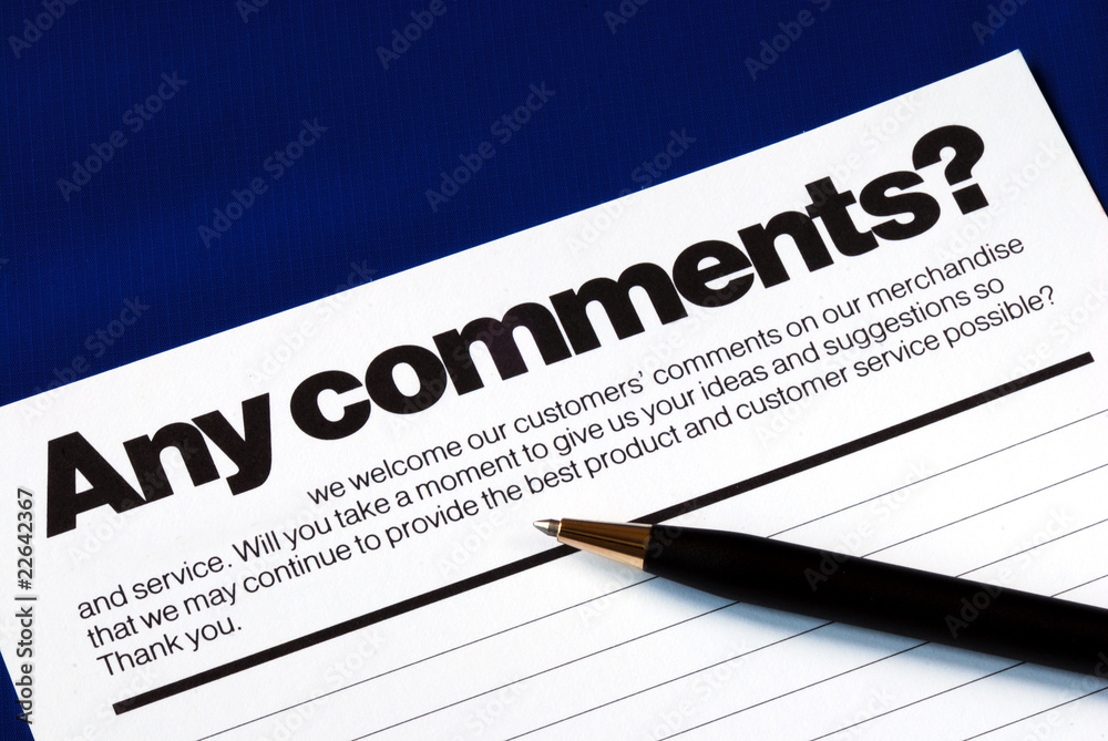 Customer fills in the feedback survey isolated on blue Customer fills in the feedback survey isolated on blue