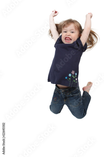 Little girl jumping on isolated white background