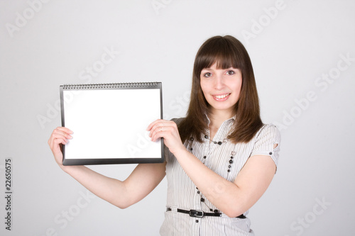 Happy young female holding blank paper