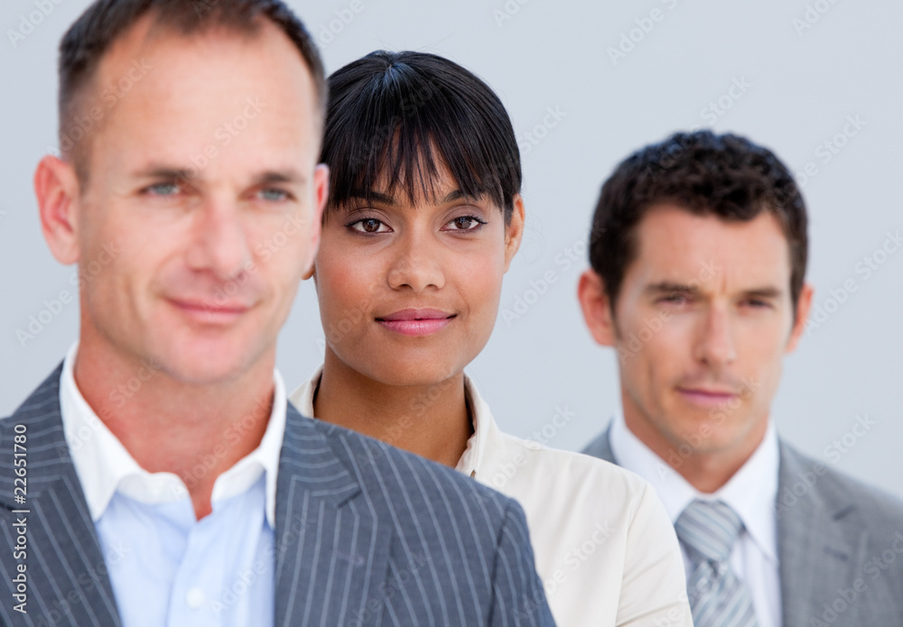 Self-assured business partners standing in a line Self-assured business partners standing in a line