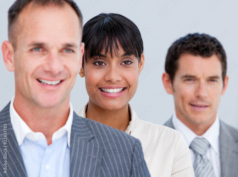 Confident business partners standing in a line Confident business partners standing in a line