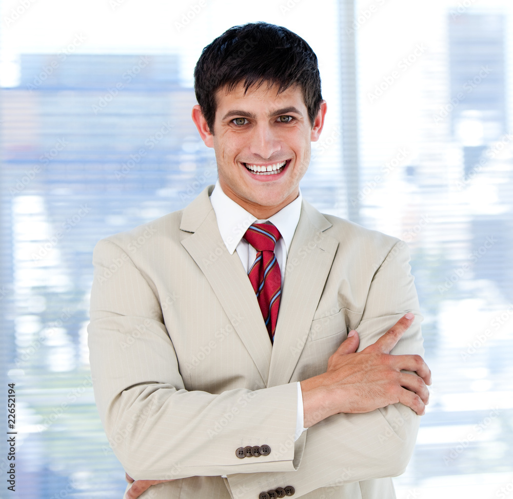 Smiling businessman with folded arms standing Smiling businessman with folded arms standing