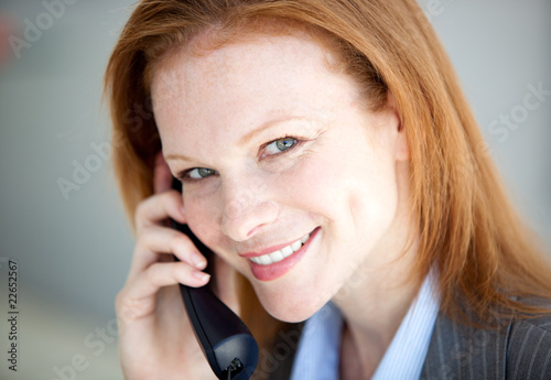 Self-assured business woman taking a call