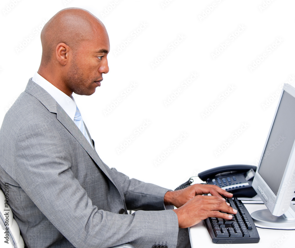 Serious businessman working at a computer Serious businessman working at a computer