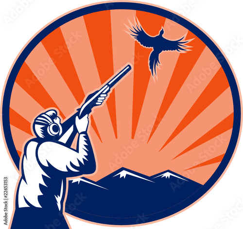 Hunter aiming shotgun rifle at bird pheasant