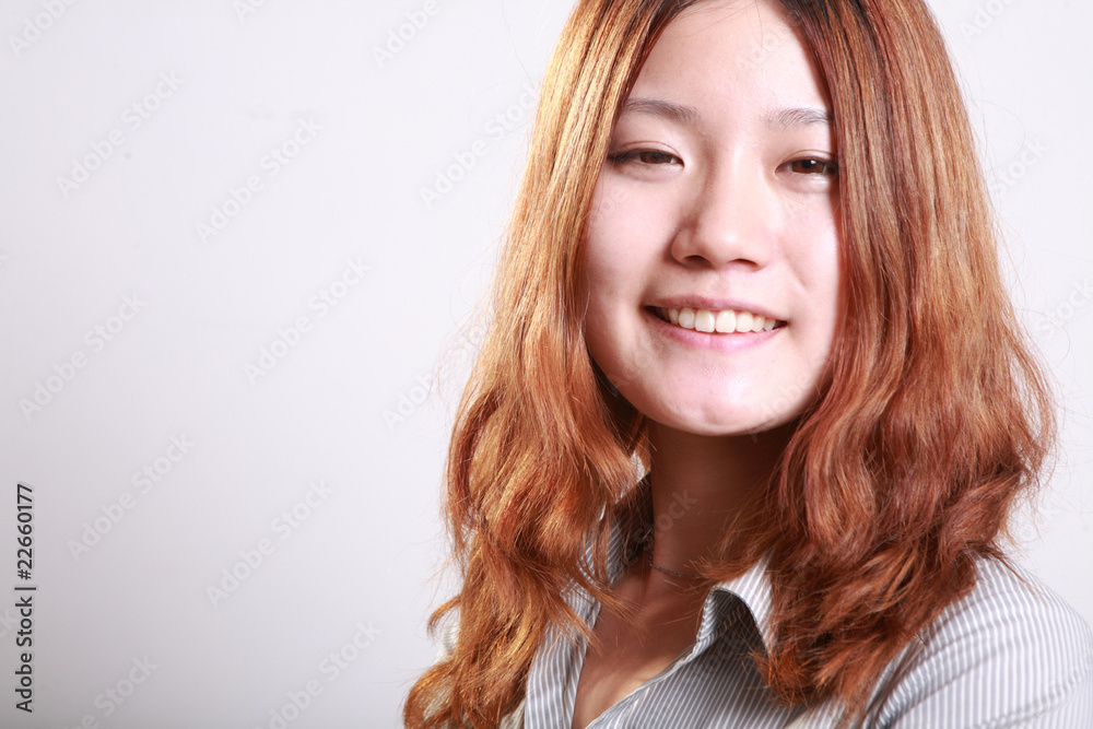 portrait of pretty young Asian girl smiling .