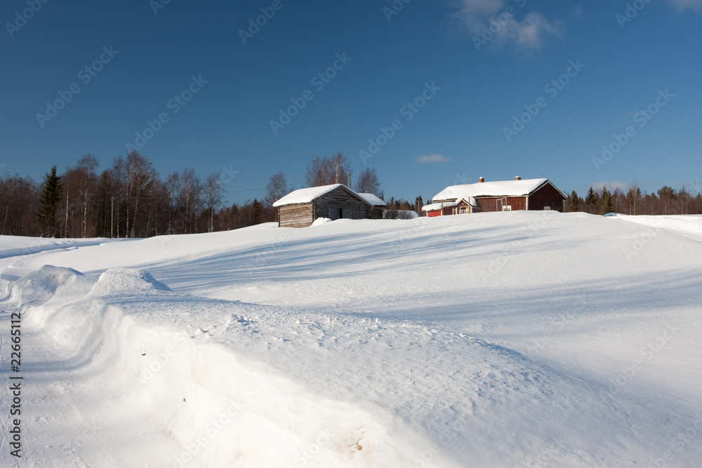 Small wooden houses in winter.