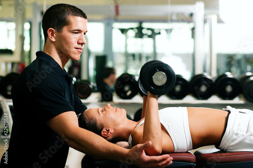 Personal Trainer in gym photo