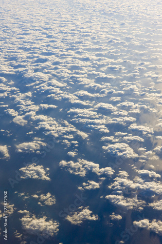 clouds above ocean - view from plane