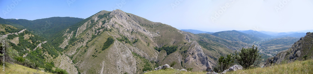 panoramic view of range of hills.