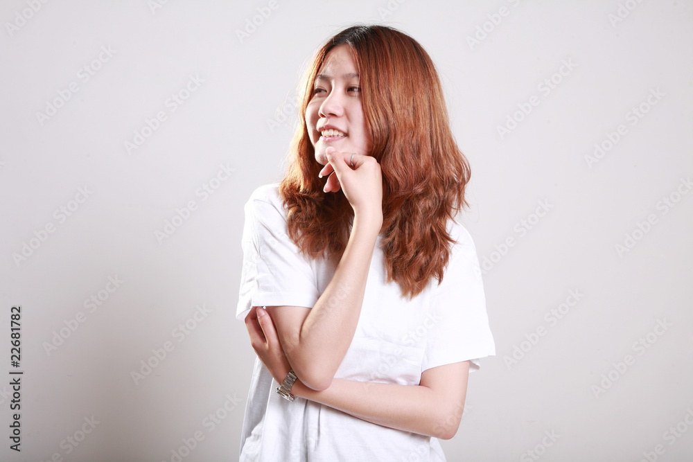 Asian female model posing in bright white t-shirt Asian female model posing in bright white t-shirt