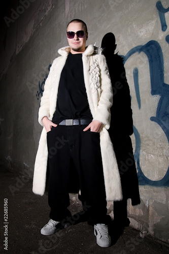 White bald man posing like a pimp