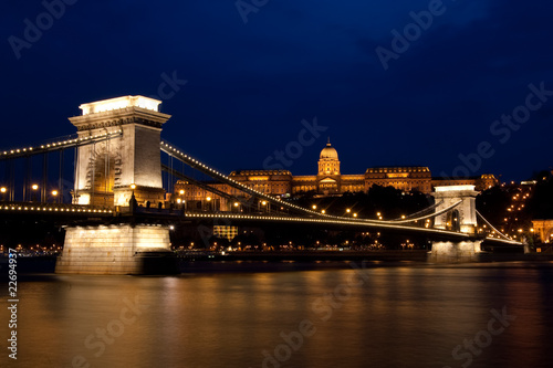 royal palace and chain bridge at night in budapest
