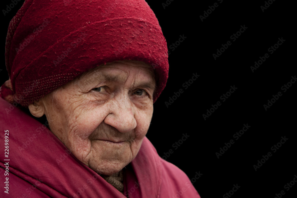 old grandma in red headscarf with piercing look old grandma in red headscarf with piercing look