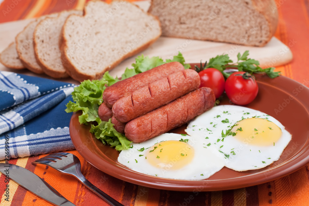 Breakfast fried eggs and sausages