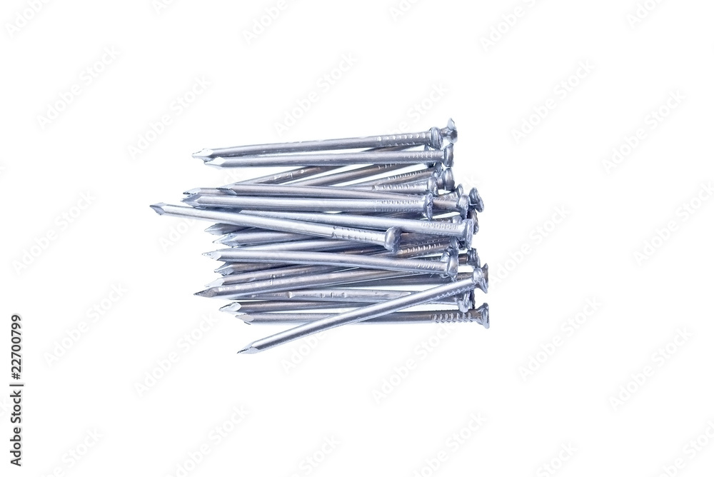 Pile of iron nails isolated on white Pile of iron nails isolated on white