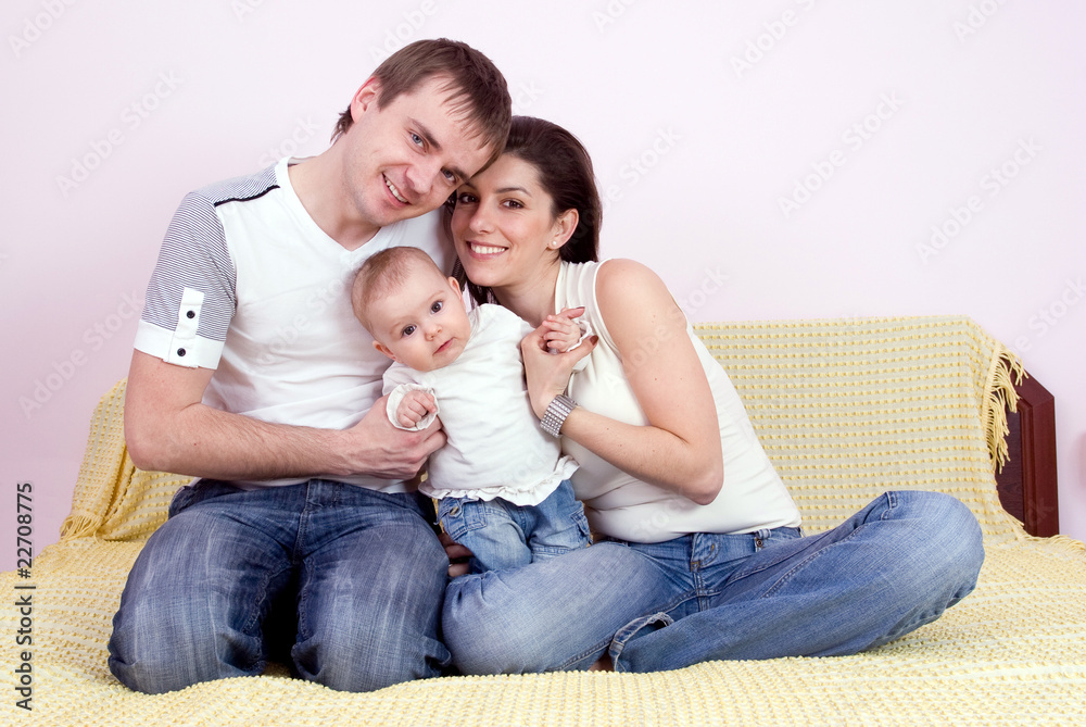 Happy family plays in the bed Happy family plays in the bed