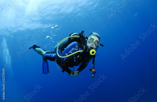 scuba diver in clear blue water