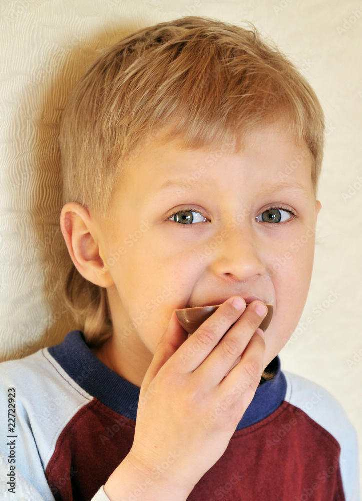boy eating chocolate egg