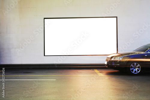 blank frame on the wall and a car passed by