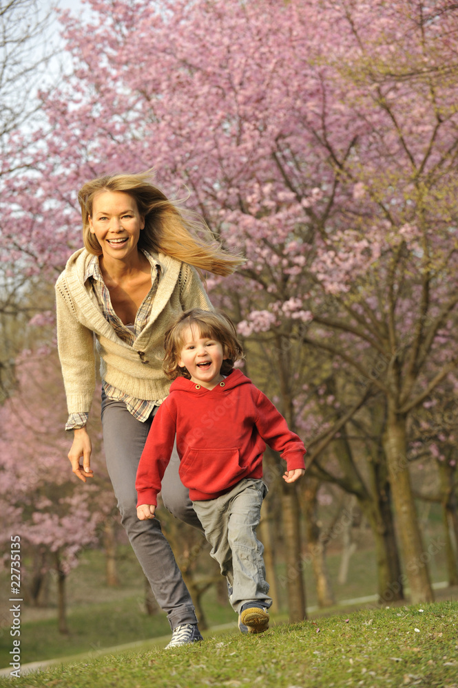 Mother and child walking through the park