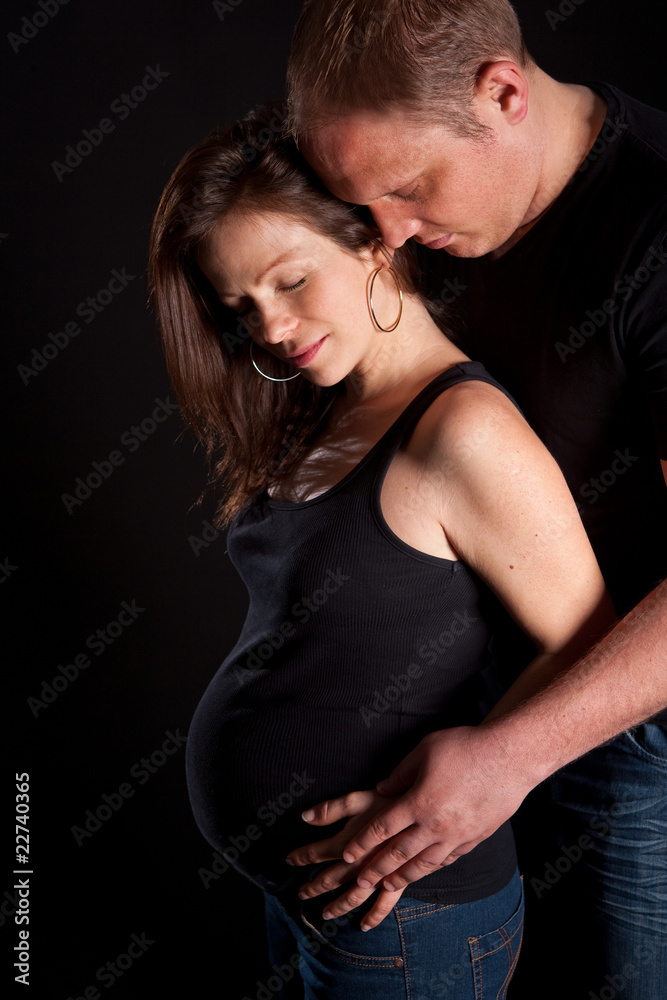 Young couple with pregnant wife