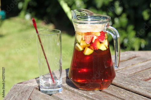 Tableau sur toile jug of Pimms and lemonade cocktail with fruit and empty glass